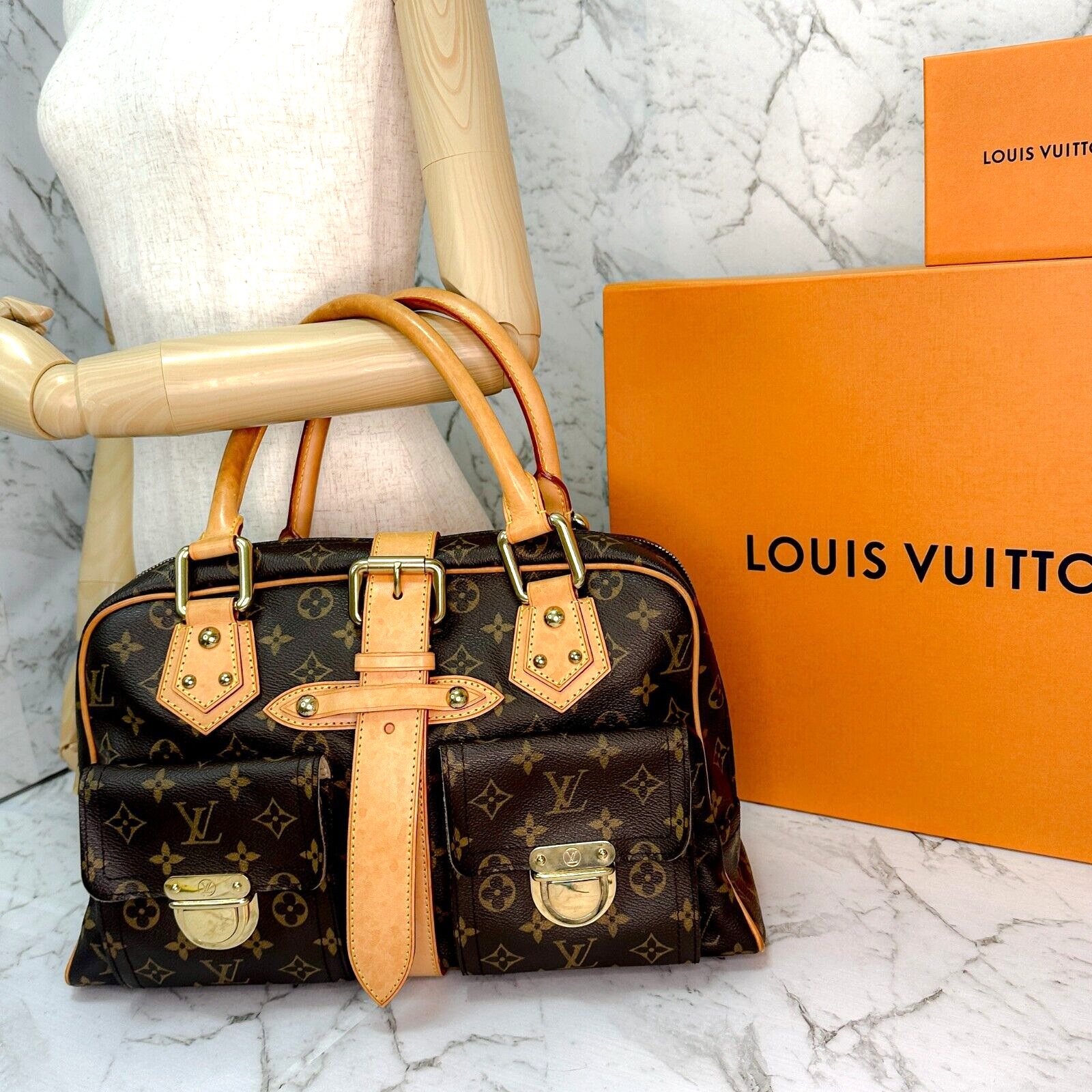 Sold at Auction: A Louis Vuitton Manhattan GM monogram canvas and