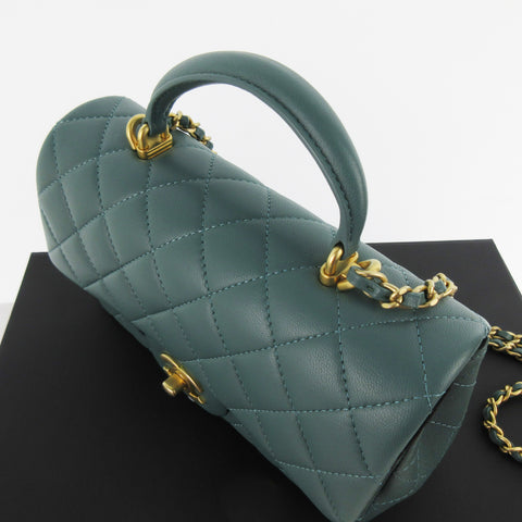 CHANEL Mini Matelasse Top Handle Mini Flap Bag Moss Green Green Antique Gold Hardware Lambskin AS2431 Random Serial Plate With Protective Seal Unused Shoulder Bag